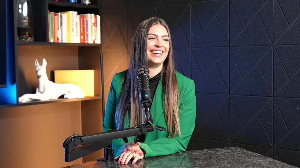 G. Lending team member laughing at the studio desk