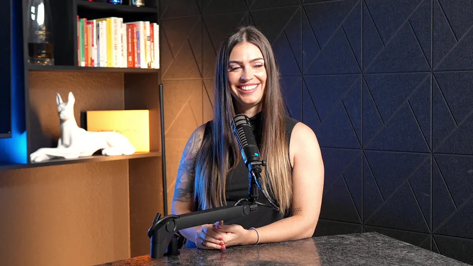 G. Lending team member at the studio desk