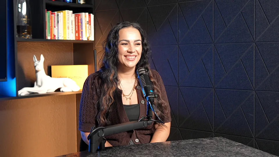 G. Lending team member smiling at the studio desk